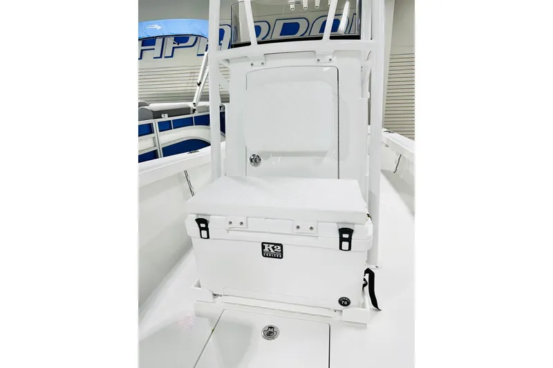 Slide: The Image of 2026 BlackJack 256 Coastal boat interior with K2 cooler and seating area. - 10