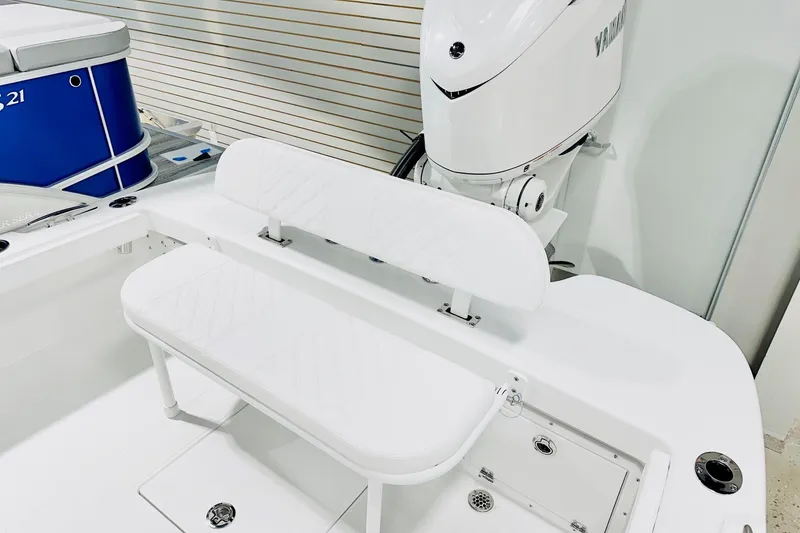 Slide: The Image of 2026 BlackJack 256 Coastal boat interior with white seating and Yamaha engine. - 13