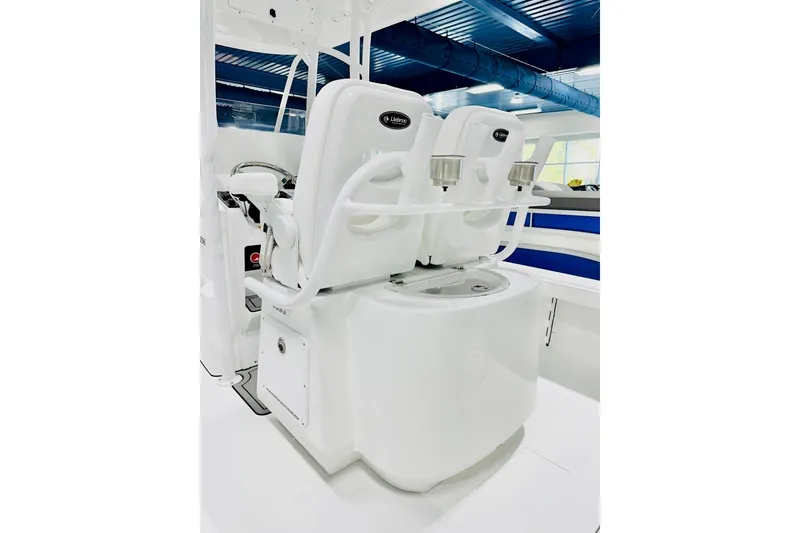Slide: The Image of 2026 BlackJack 256 Coastal boat interior with dual seats and storage compartment. - 3