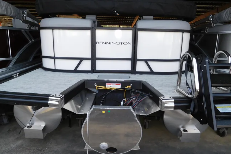 The Image of 2026 Bennington 22 SSRSF pontoon boat rear view with ladder and motor area. - 1