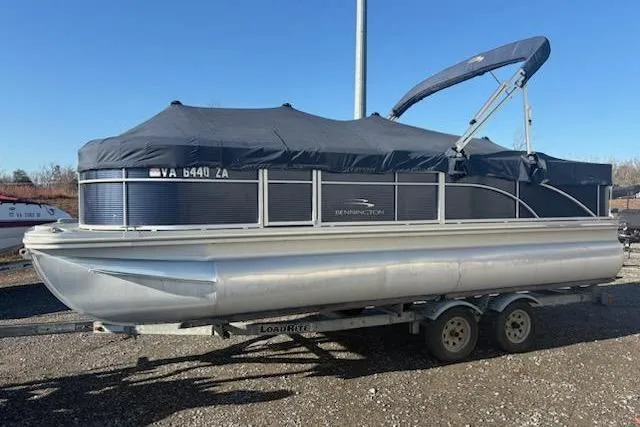 Slide: The Image of 2020 Bennington 21SSX pontoon boat on trailer, covered and ready for transport. - 12