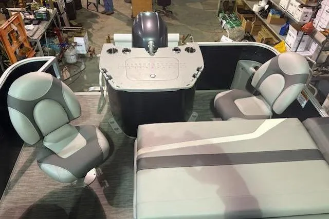 Slide: The Image of 2020 Bennington 21SSX boat interior with gray seating and control panel. - 19