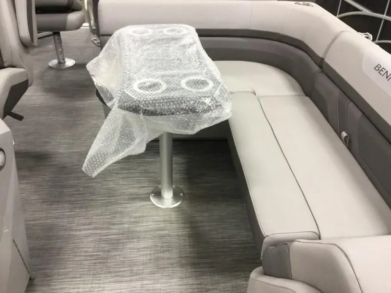 Slide: The Image of Interior of 2020 Bennington 21SSX with cushioned seating and table. - 4