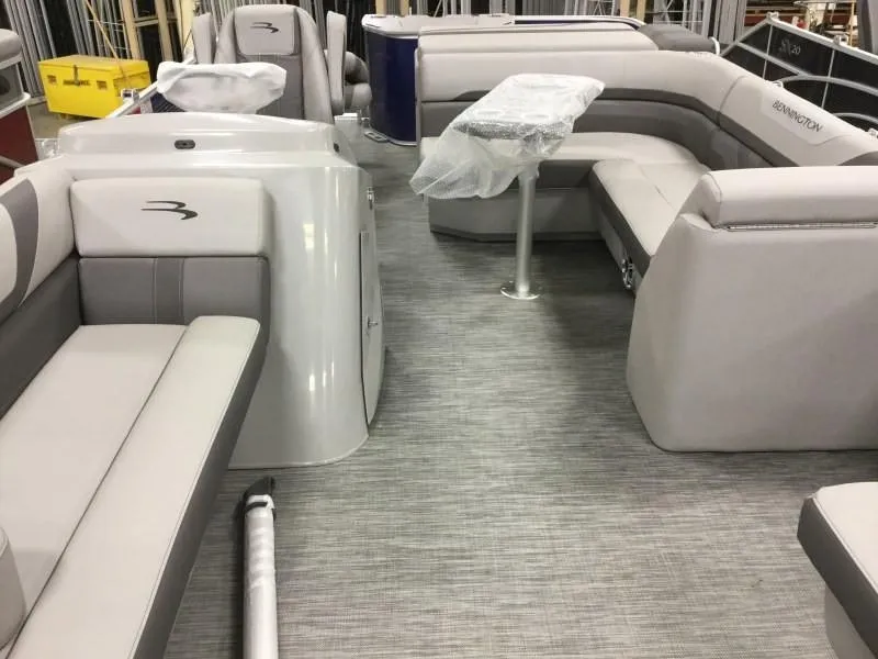 Slide: The Image of Interior of a 2020 Bennington 21SSX pontoon boat with gray seating. - 6