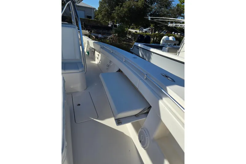 Slide: The Image of 2013 Invincible 42 Open Fisherman boat interior with seating and storage. - 11