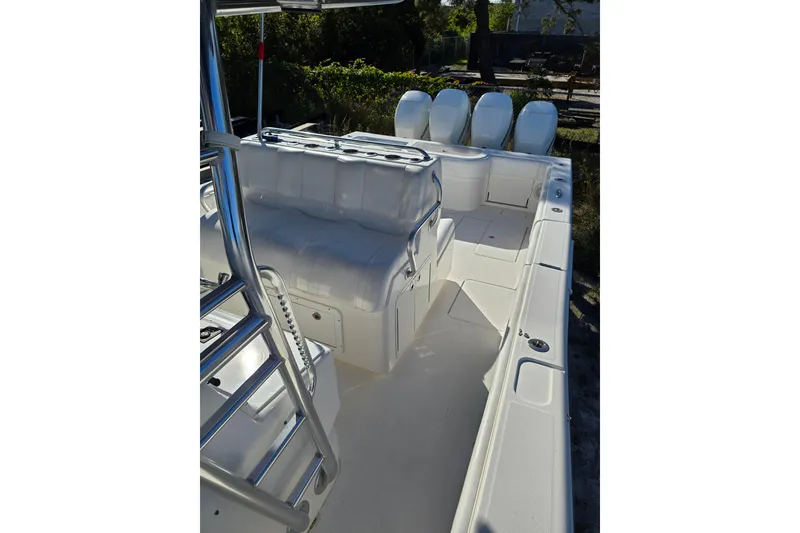 Slide: The Image of 2013 Invincible 42 Open Fisherman boat interior with seating and stainless steel fixtures. - 15