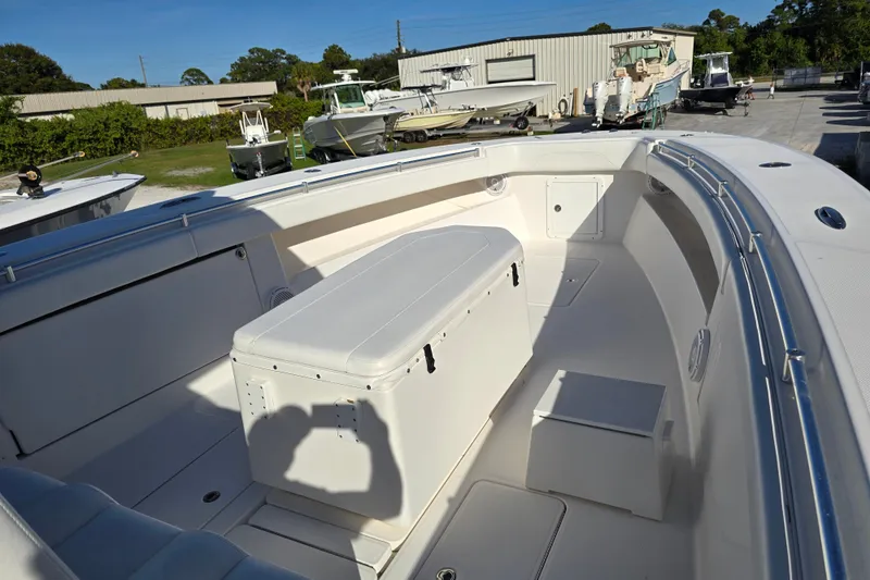 Slide: The Image of 2013 Invincible 42 Open Fisherman boat interior with seating and storage. - 7