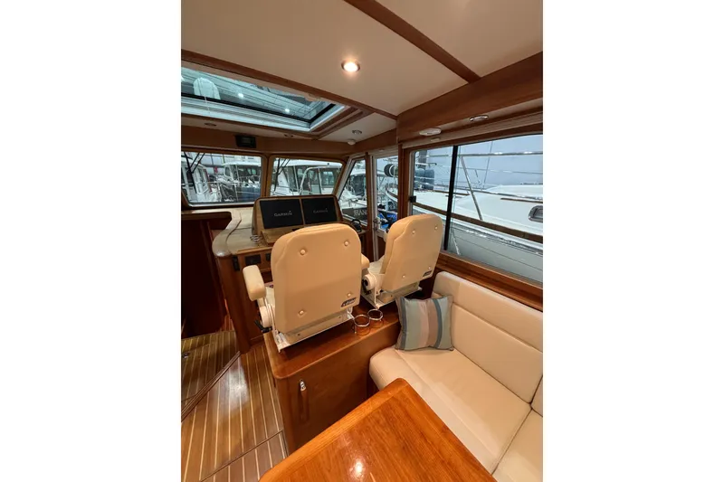 Slide: The Image of Interior of 2020 Sabre 45 Salon Express yacht with helm and seating area. - 31