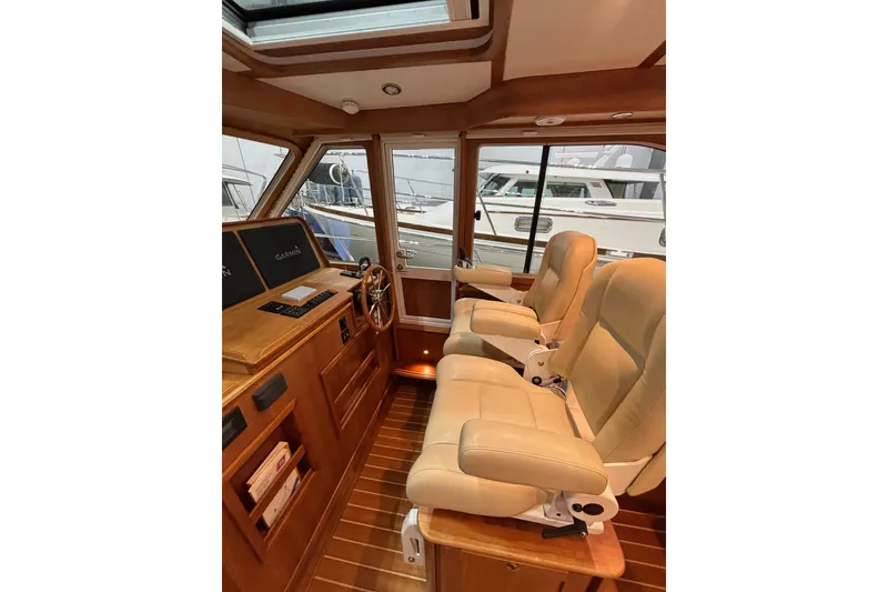 Slide: The Image of Interior of 2020 Sabre 45 Salon Express yacht with leather seating and wooden accents. - 32