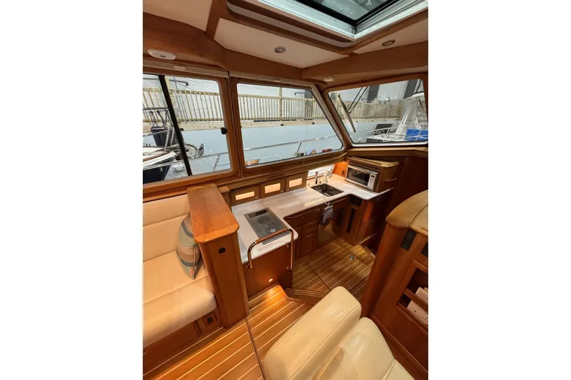 Slide: The Image of Interior of 2020 Sabre 45 Salon Express yacht with wood finish and modern amenities. - 35