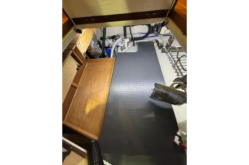 Slide: The Image of Engine room of 2020 Sabre 45 Salon Express with organized equipment and storage. - 39