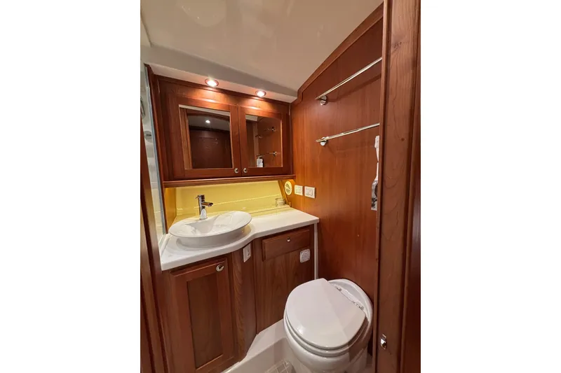 Slide: The Image of Luxurious bathroom in 2020 Sabre 45 Salon Express yacht with wooden cabinetry. - 42