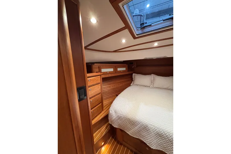 Slide: The Image of Luxurious cabin interior of 2020 Sabre 45 Salon Express yacht with wood finish and skylight. - 45