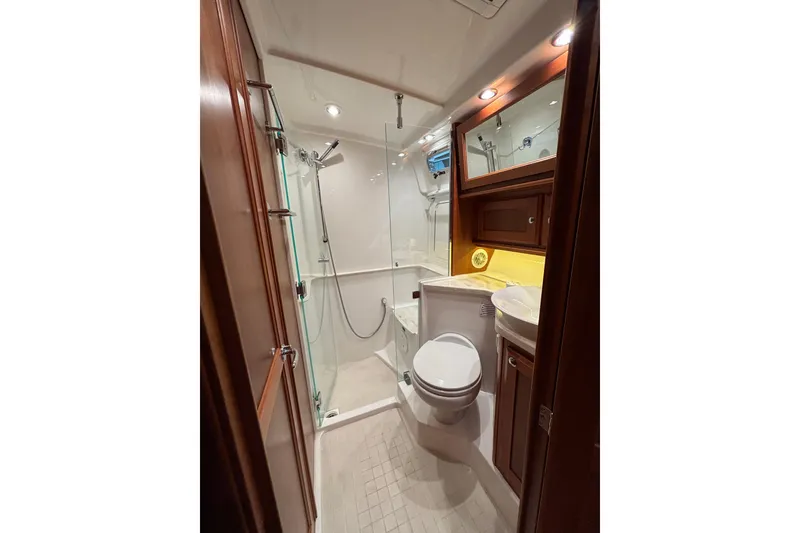 Slide: The Image of Luxurious bathroom in 2020 Sabre 45 Salon Express yacht with shower and wooden cabinetry. - 55