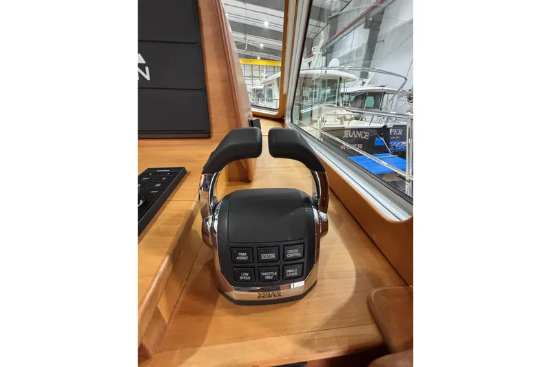 Slide: The Image of Control panel of 2020 Sabre 45 Salon Express yacht, featuring throttle and cruise control. - 78