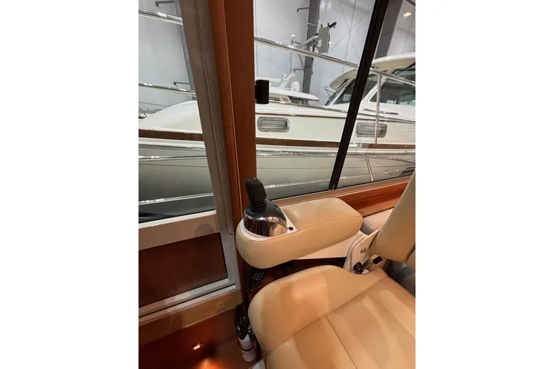 Slide: The Image of Interior view of 2020 Sabre 45 Salon Express yacht with leather seating and joystick control. - 79
