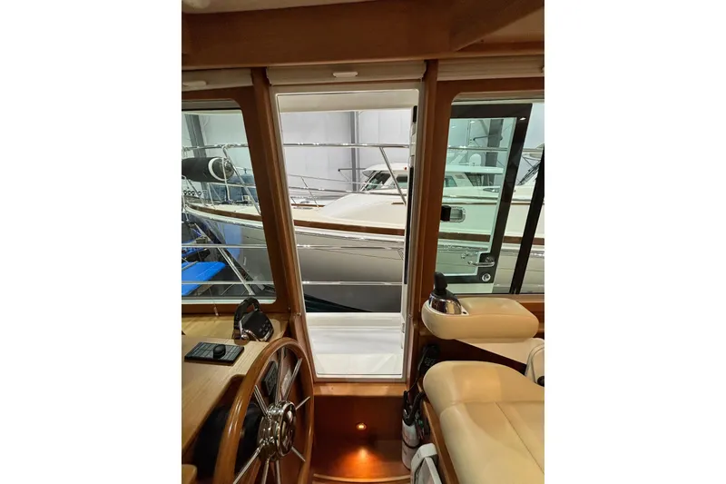Slide: The Image of Interior view of 2020 Sabre 45 Salon Express yacht, showcasing helm and seating area. - 81