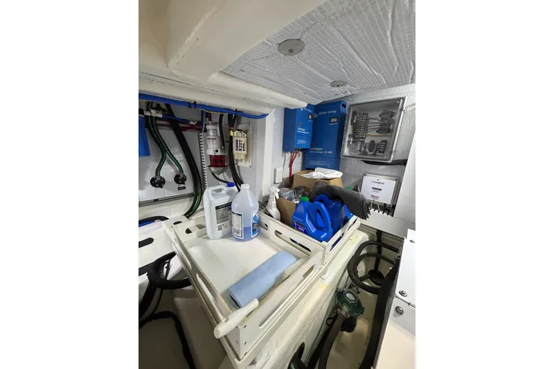Slide: The Image of Engine room of 2020 Sabre 45 Salon Express with maintenance supplies and equipment. - 85