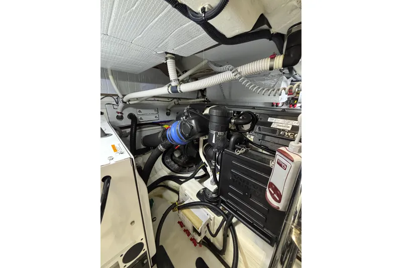 Slide: The Image of Engine room of 2020 Sabre 45 Salon Express with visible components and wiring. - 89