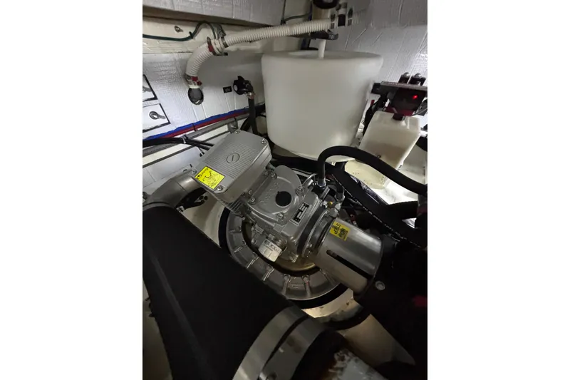 Slide: The Image of Engine room of 2020 Sabre 45 Salon Express yacht, showcasing mechanical components. - 90