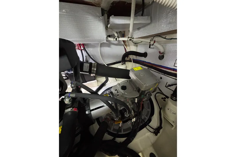 Slide: The Image of Engine room of 2020 Sabre 45 Salon Express with visible mechanical components. - 93