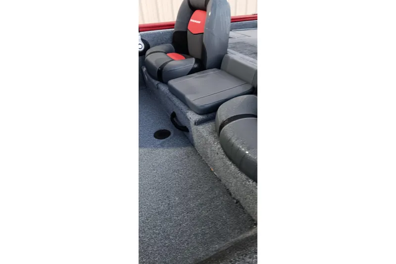 Slide: The Image of 2025 Tracker Pro Team 190 boat interior with gray and red seating. - 2