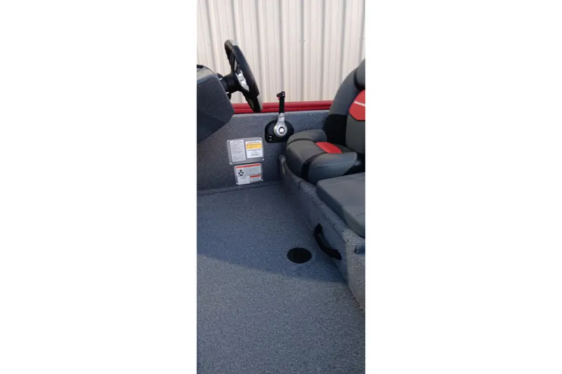Slide: The Image of 2025 Tracker Pro Team 190 boat interior with steering wheel and seating. - 23