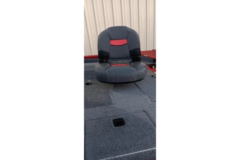Slide: The Image of 2025 Tracker Pro Team 190 boat seat with red and black accents. - 3