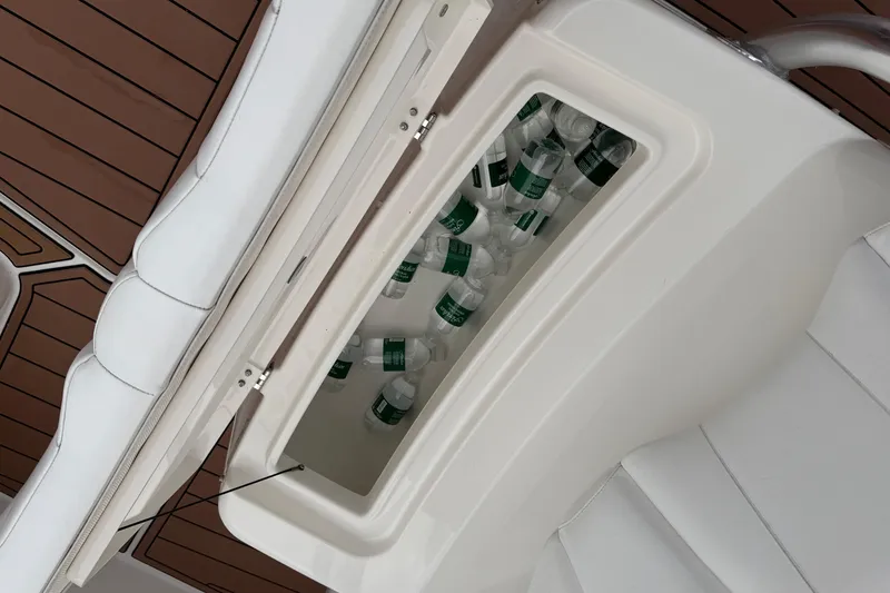 Slide: The Image of Twin outboard motors covered on a 2015 Regulator 25 boat, floating on water. - 11