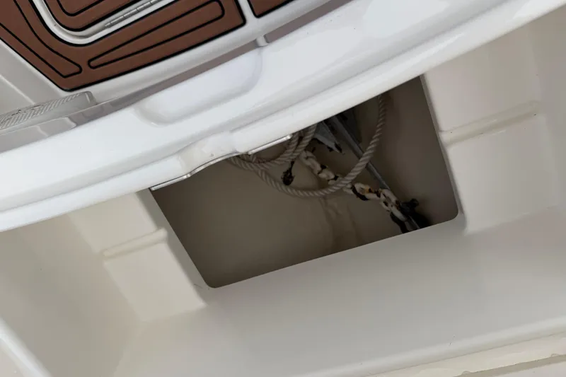 Slide: The Image of 2015 Regulator 25 boat dashboard with navigation screens and controls. - 13