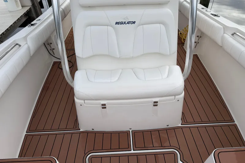 Slide: The Image of 2015 Regulator 25 boat anchor storage compartment with open hatch. - 18