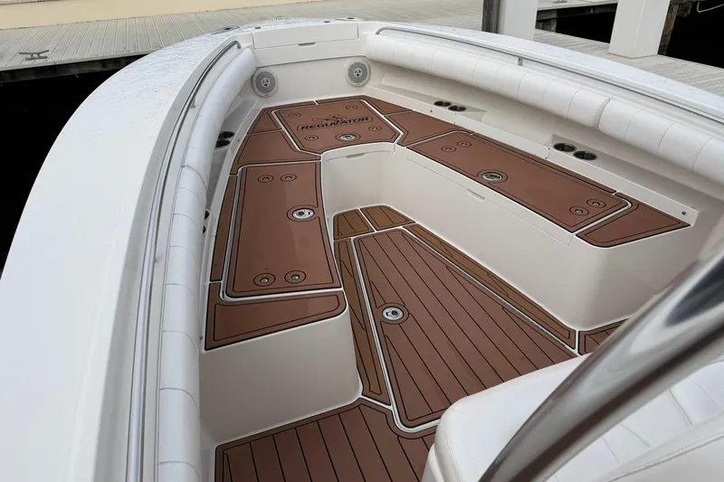 Slide: The Image of Storage compartment on 2015 Regulator 25 boat with life jackets and safety gear. - 19