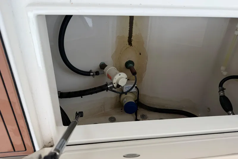 Slide: The Image of 2015 Regulator 25 boat seat with storage compartment on teak deck. - 21