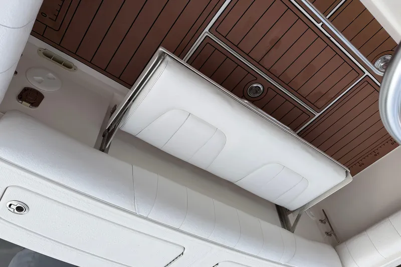 Slide: The Image of 2015 Regulator 25 boat interior with speaker and coiled yellow hose. - 22