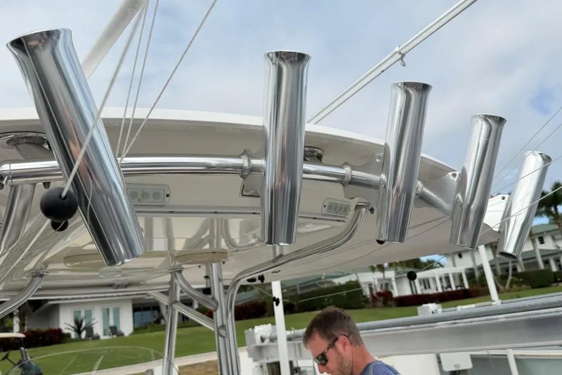 Slide: The Image of 2015 Regulator 25 boat cruising on open water with twin engines. - 5