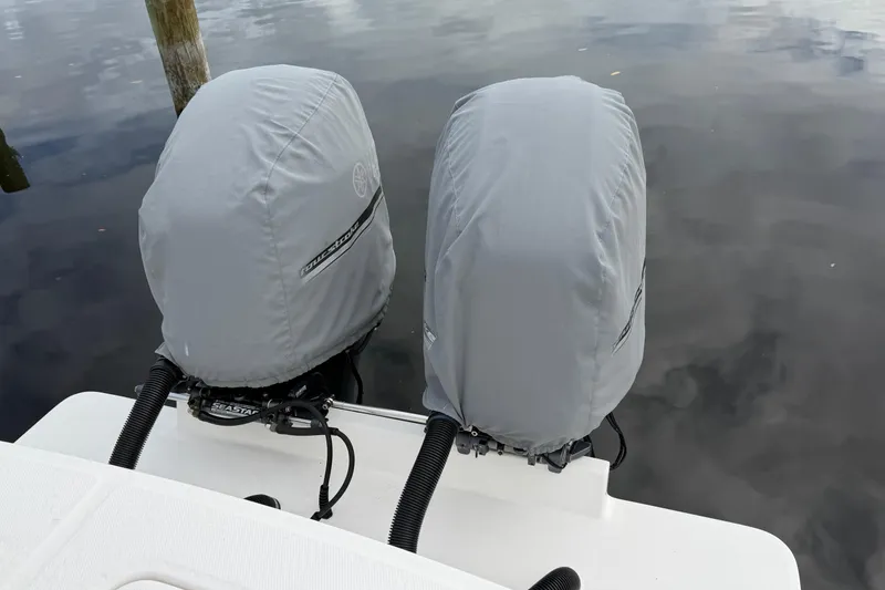 Slide: The Image of 2015 Regulator 25 boat cruising on open water under a clear blue sky. - 6