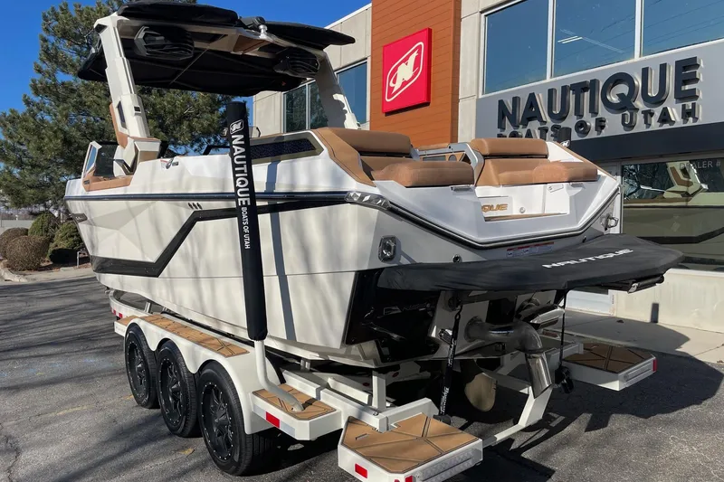 Slide: The Image of 2025 Nautique Super Air Nautique G25 Paragon boat at dealership, rear view. - 3