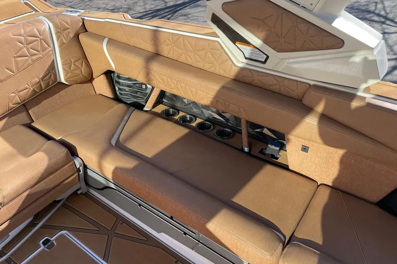 Slide: The Image of Luxurious interior of 2025 Nautique Super Air Nautique G25 Paragon boat with tan upholstery. - 9
