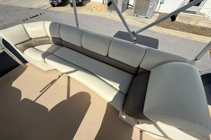 Slide: The Image of 2013 Silver Wave 220 Island CL boat with spacious beige seating area. - 12