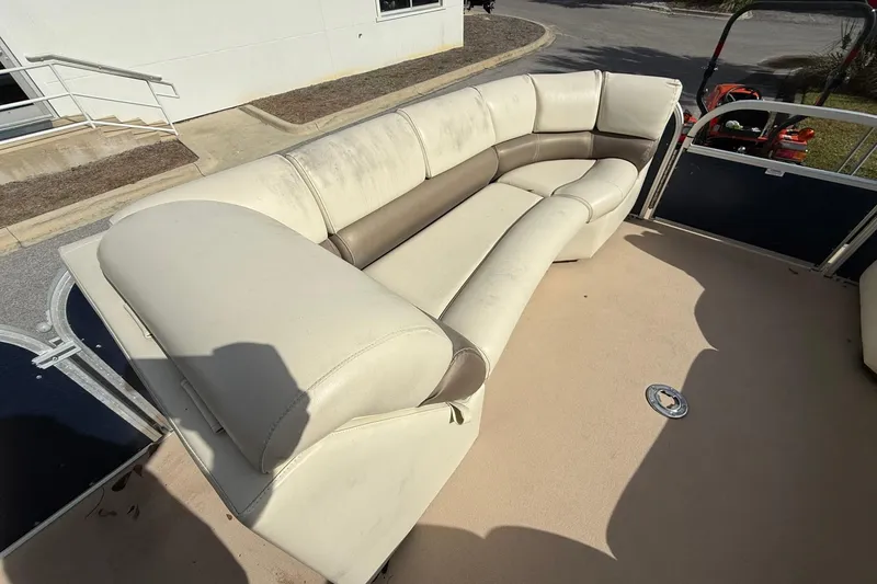 Slide: The Image of 2013 Silver Wave 220 Island CL boat with beige seating and spacious deck area. - 6