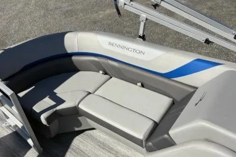 Slide: The Image of 2025 Bennington 22SXSR boat interior with gray and blue seating. - 10