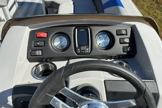 Slide: The Image of Dashboard of 2025 Bennington 22SXSR boat with steering wheel and gauges. - 7