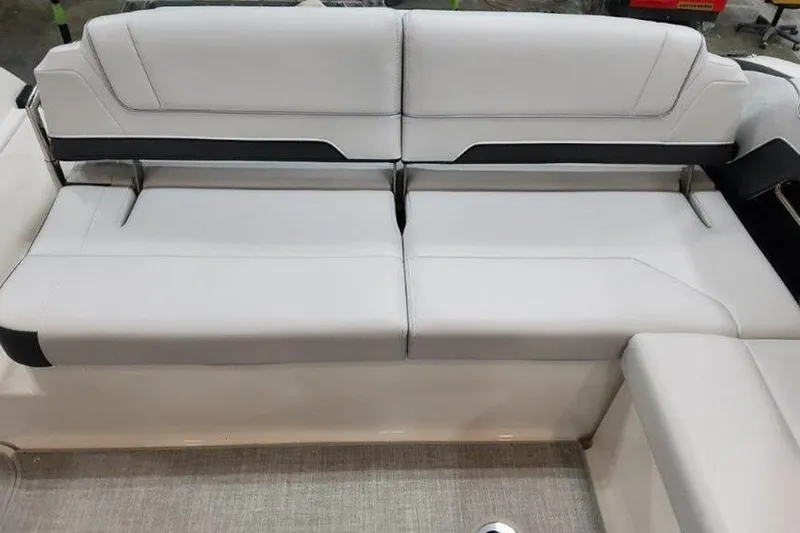 Slide: The Image of 2025 Formula 330 Crossover Bowrider I/O seating area in light leather. - 11