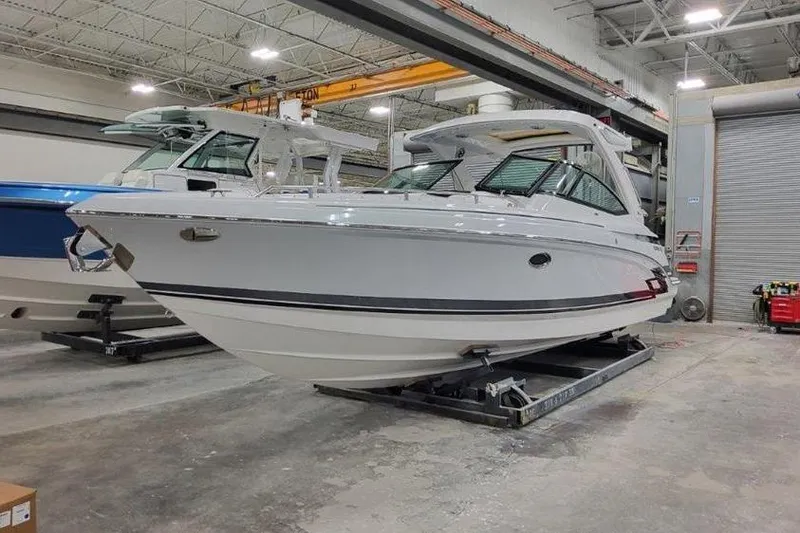 Slide: The Image of 2025 Formula 330 Crossover Bowrider in showroom. - 12