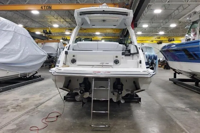 Slide: The Image of 2025 Formula 330 Crossover Bowrider I/O in a boatyard. - 18