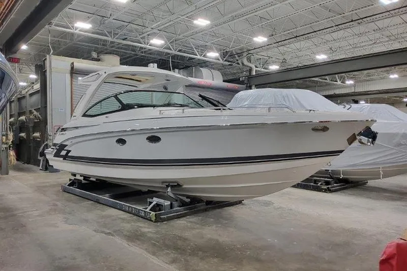 Slide: The Image of 2025 Formula 330 Crossover Bowrider I/O in a boatyard. - 20