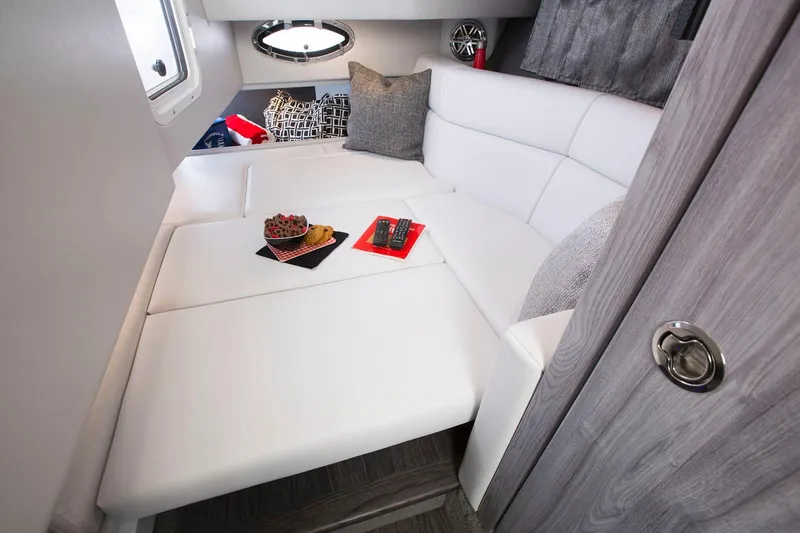 Slide: The Image of Manufacturer Provided Image: 2025 Formula 330 Crossover Bowrider I/O cabin interior with white seating and modern decor. - 8