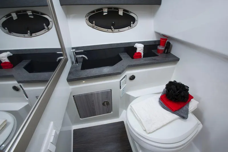 Slide: The Image of Manufacturer Provided Image: 2025 Formula 330 Crossover Bowrider I/O bathroom with modern sink and toilet. - 9