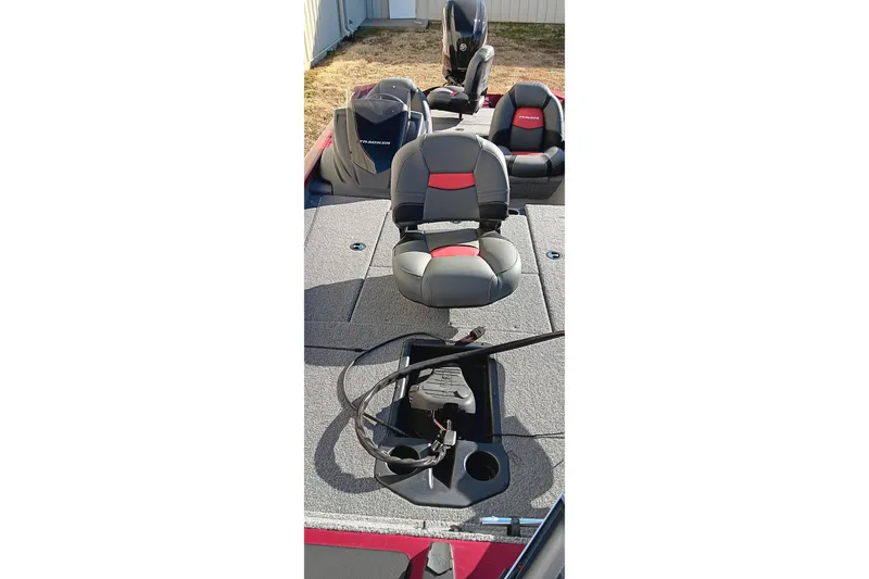 Slide: The Image of 2025 Tracker Pro Team 175 boat interior with seating and steering wheel. - 13