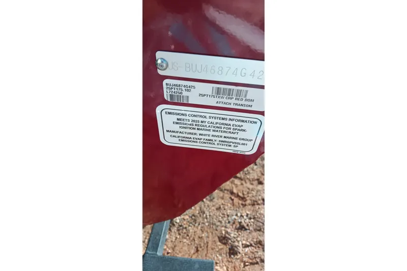 Slide: The Image of 2025 Tracker Pro Team 175 emissions label on red surface, showing compliance details. - 21